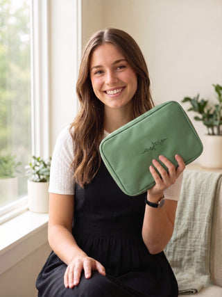 A sister missionary holding the pack, showing its size